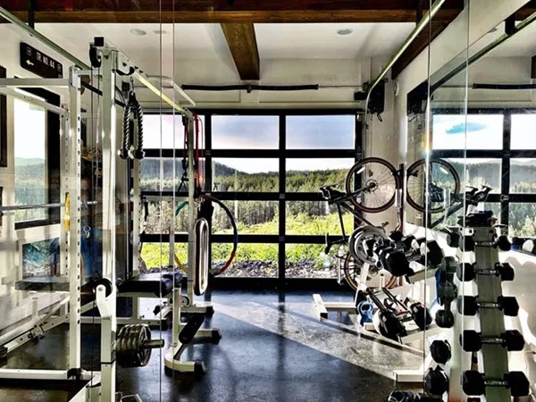 gym workout room with a glass garage door 